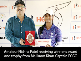 Amateur Nishna Patel receiving winner's award and trophy from Mr. Ikram Khan-Captain PCGC