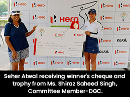 Seher Atwal receiving winner's cheque and trophy from Ms. Shiraz Saheed Singh, Committee Member-DGC.