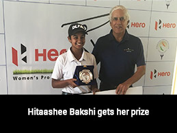 Hitaashee Bakshi receiving winner's trophy & cheque from Mr. Ravi Grover, COO - Golden Greens